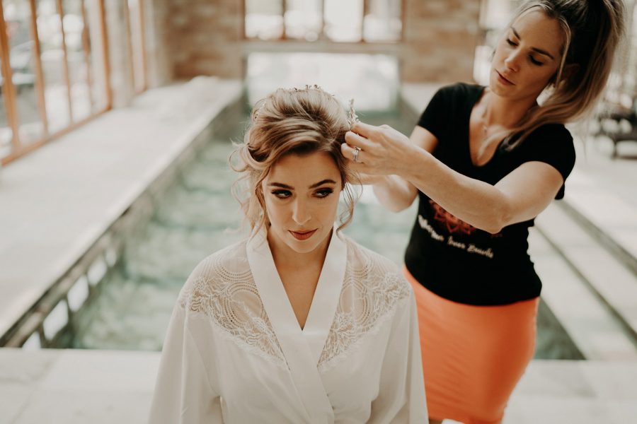 sydney boho elegant wedding. bride doing her hair
