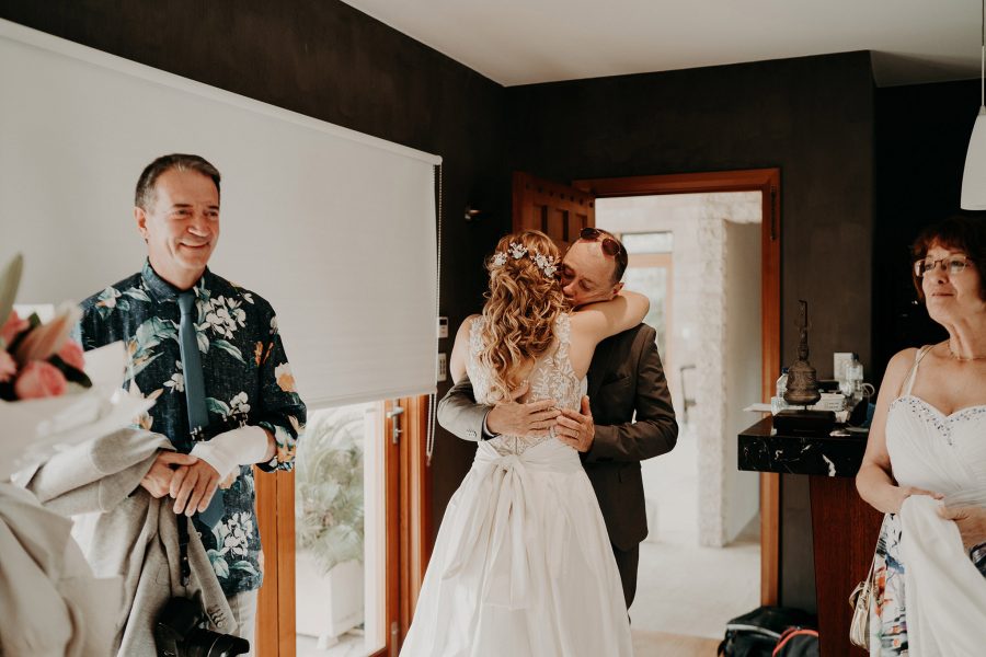 sydney boho elegant wedding. bride hugging her father